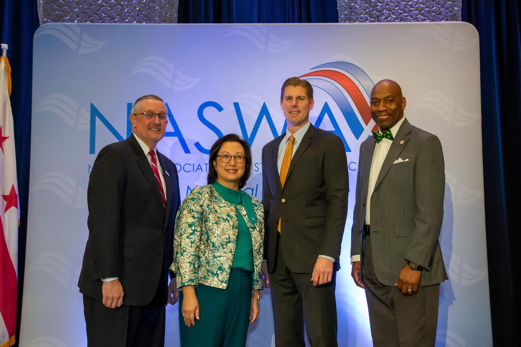 Scott Sanders, NASWA Executive Director, Anna Hui, NASWA Board President, John P. Pallasch, Assistant Secretary for Employment and Training, USDOL, and Fitzgerald Washington, NASWA Board President-Elect pose for a photo